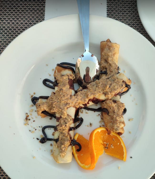 restaurant rogoznica dessert pancakes decoration orange white plate